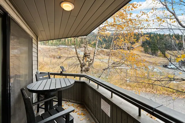 Step out to the covered balcony with your coffee and watch the mountainside wake up two chairs, one table, zero reason to rush back inside.