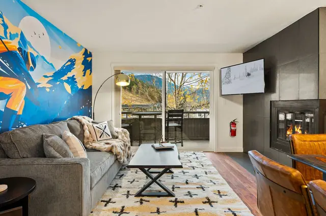 Slide the balcony door open, flip the fireplace on, and settle into the sectional with the mountain still in view this is the room you'll end every day in.