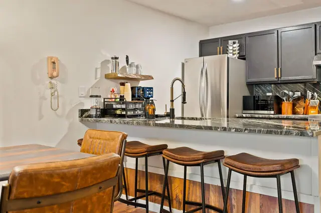 Pull up a stool at the island and warm up next to the wood-burning stove while dinner's still cooking you won't be the one left standing.
