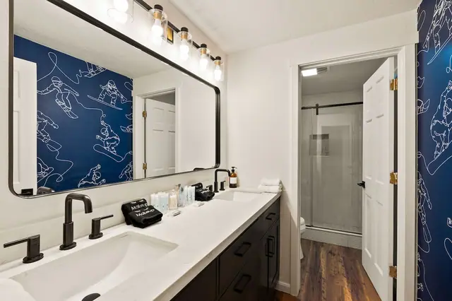 Get ready for the day at the mirror, then slide the door shut and let the walk-in shower wash yesterday's run right off you.