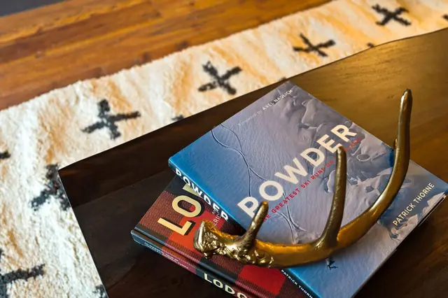 Pick up Powder or Lodo off the coffee table while you plan tomorrow's runs small touches like these are why this place doesn't feel like a rental.