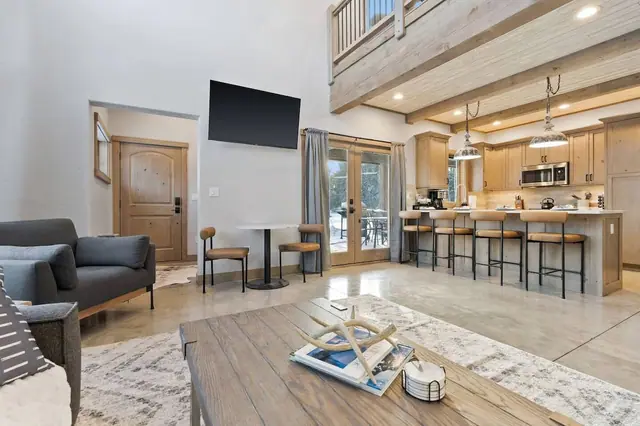 Settle in for a movie night or a quick card game at the little table the whole main floor keeps your group connected instead of splitting off.