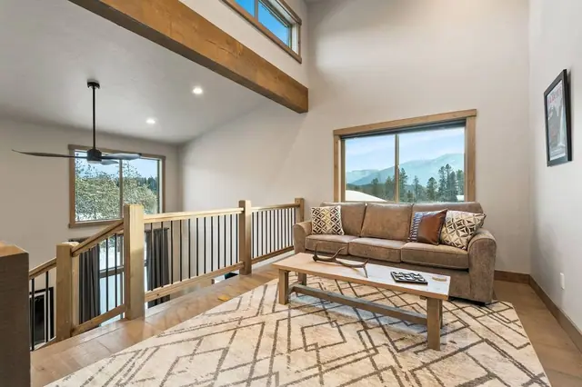 Sneak upstairs to the loft when you want the mountain view without the noise the whole main floor unfolds below you from the railing.