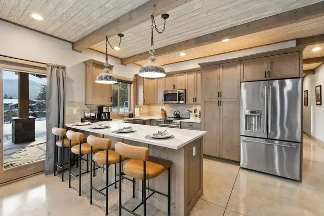 Pick a stool at the island while dinner's cooking and watch the yard turn white with snow right outside your glass door.