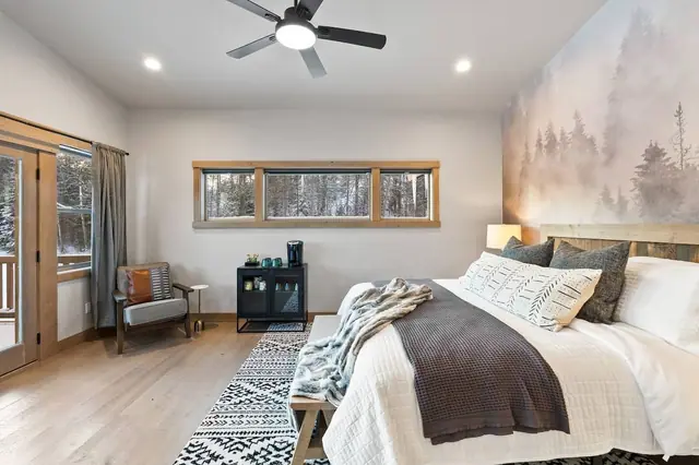 Pour a nightcap from the bar cabinet and watch the light fade through the windows this master suite is built for slowing your whole trip down.