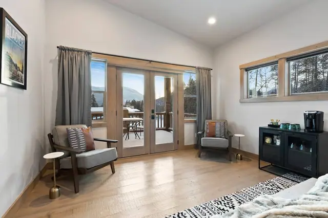 Curl up in the armchairs before the French doors open onto the deck this is the corner of the master suite where your mornings start slow.