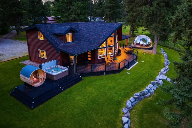 Soak in the whole retreat at once, your hot tub, barrel sauna, and glowing geodome lit up together as the forest goes dark around you.