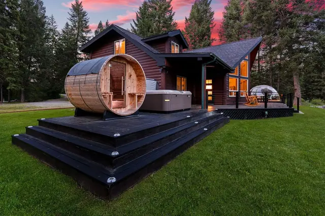 Step onto the deck and take in all three, your barrel sauna, hot tub, and geodome glowing under string lights at dusk.