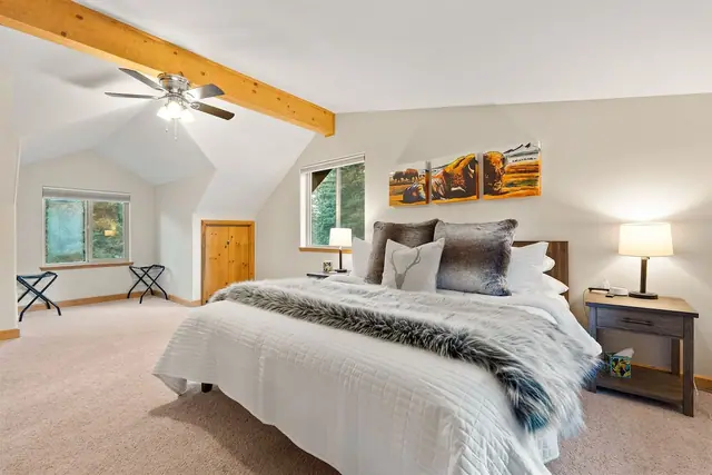 Fall asleep under vaulted ceilings and a mountain triptych in your third private king bedroom retreat.