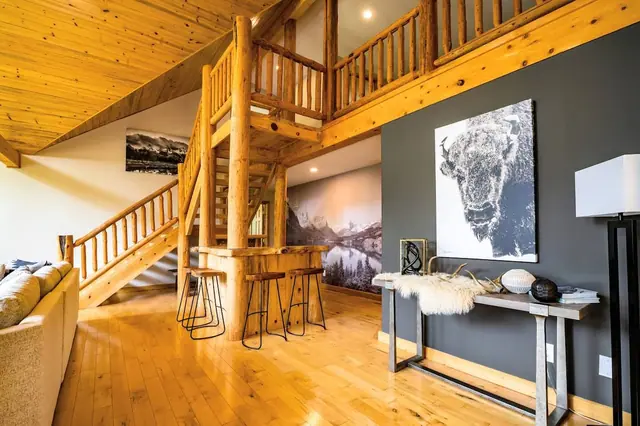 Pass the bold black-and-white bison portrait on the landing as you head up toward the loft and bar stools.