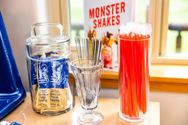 Load up your milkshake with chocolate fudge topping under the Monster Shakes sign, no ice cream shop required.