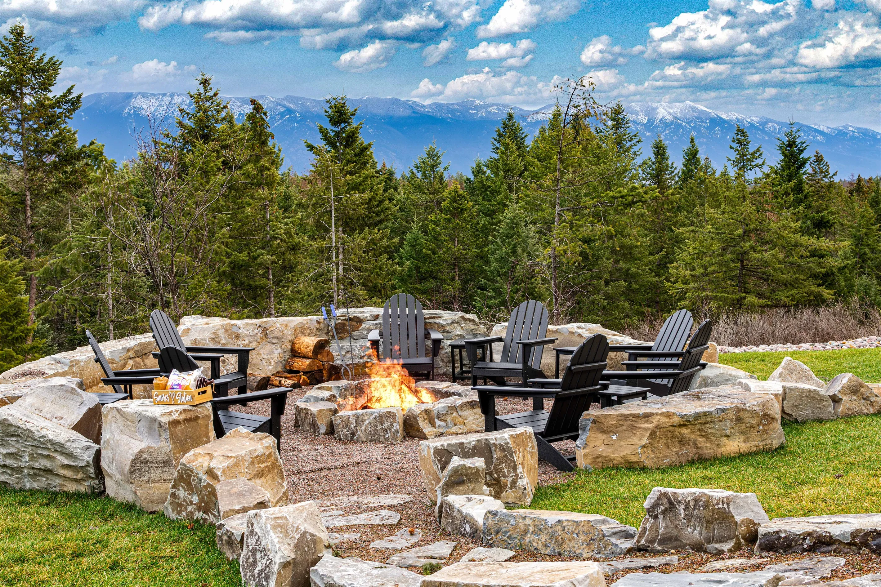The deck at Lodge 93 at dusk, the barrel sauna, hot tub and geodome all lit