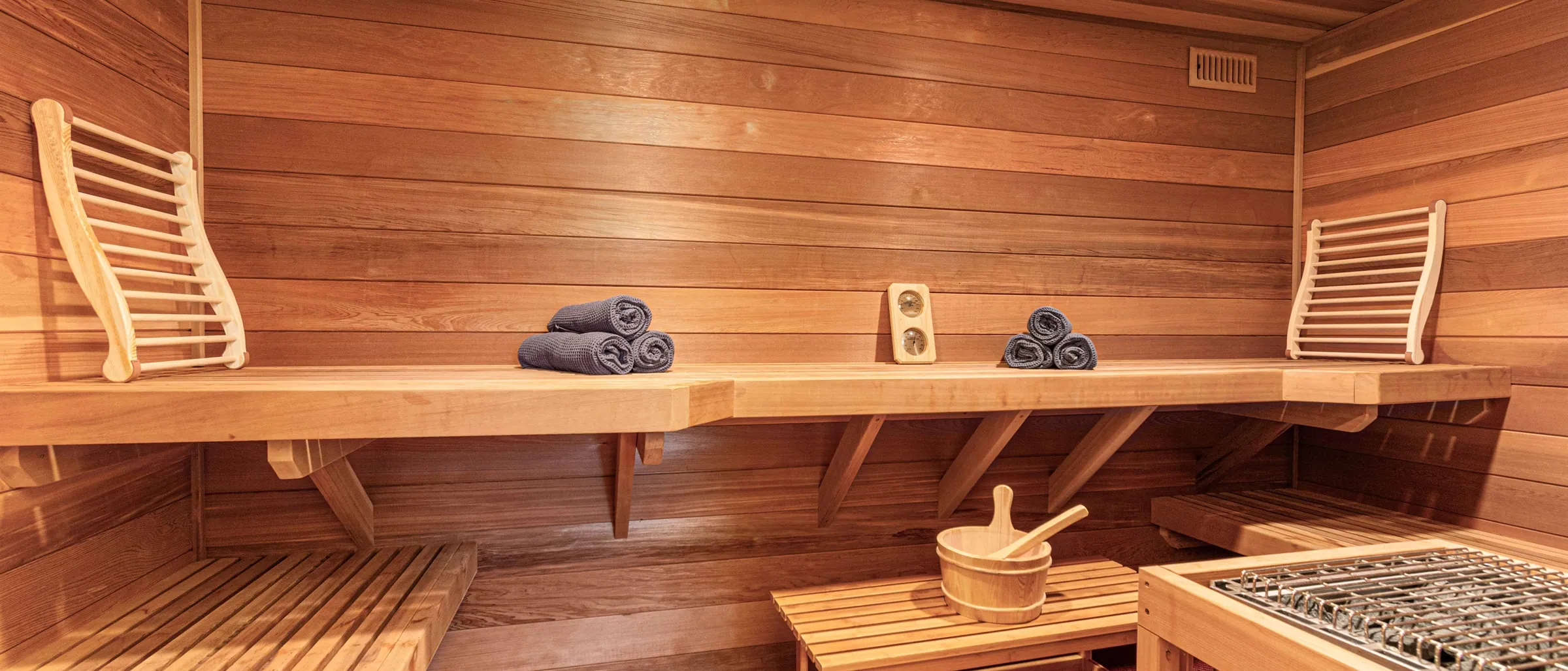 The wood-panelled sauna at Soaring Eagle, ladle and bucket ready on the bench