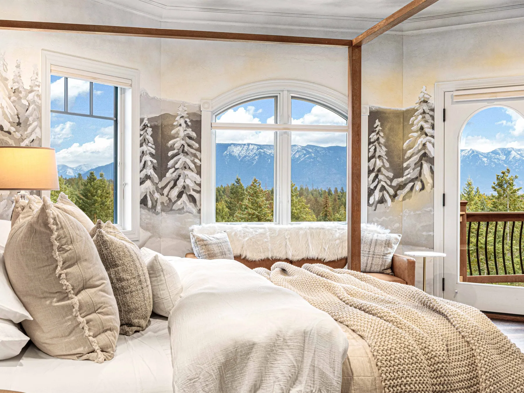 The master suite, the canopy bed and a wall of glass onto the snow-capped range