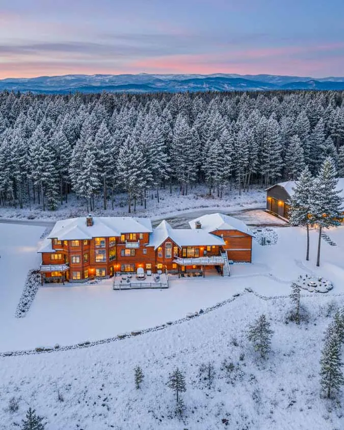 Soaring Eagle Lodge from the air after a snowfall, the forest white to the horizon