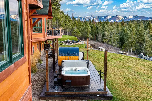 Slide into your private hot tub one of two on this deck as string lights flicker on and the peaks disappear into steam.