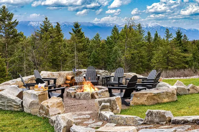 Settle into an Adirondack chair by the crackling fire pit with a full view of the snow-capped range in front of you.