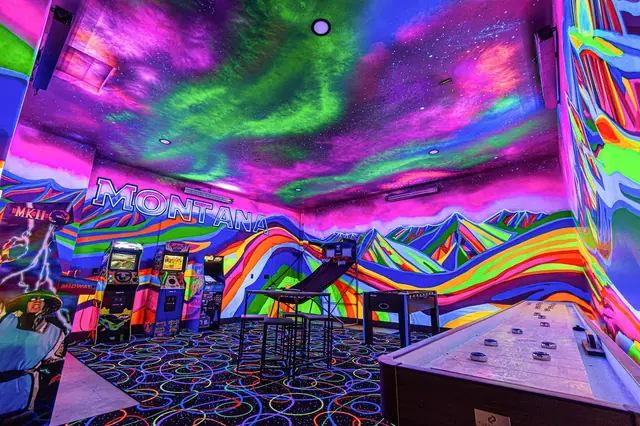 Flip on the blacklights and watch the psychedelic mountain mural and glowing carpet turn your arcade night into a full sensory experience.