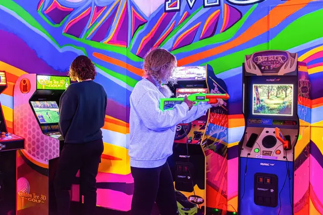 Challenge each other on the shooting and golf arcade cabinets while the glowing carpet lights up the room around you.