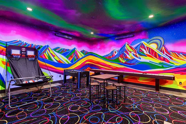 Shoot hoops on the arcade basketball game or grab a foosball table this room has a station for everyone in your group.