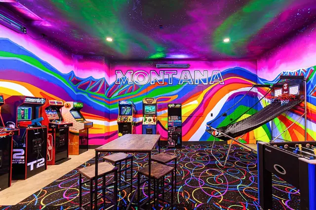 Grab a stool at the high-top table under the glowing MONTANA sign between your rounds on the arcade cabinets.