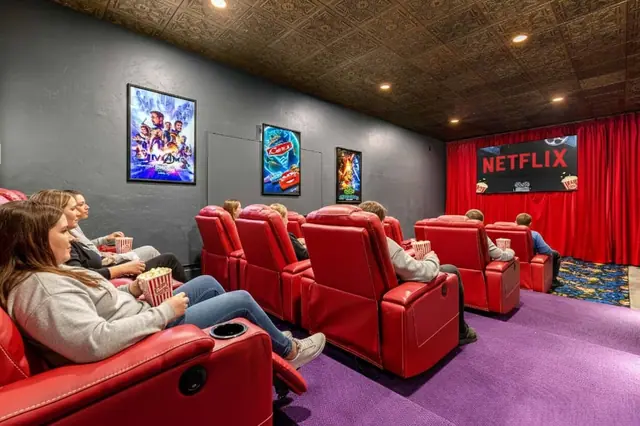 Sink into a recliner with popcorn as your group settles in and the screen lights up behind the red curtain.