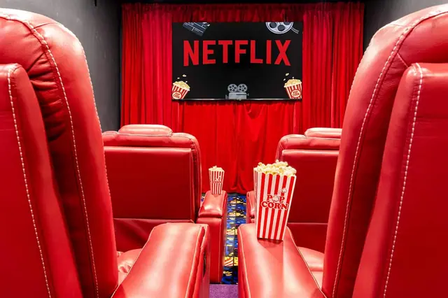 Set your popcorn on the armrest tray between the recliner rows and settle in before the curtain opens.