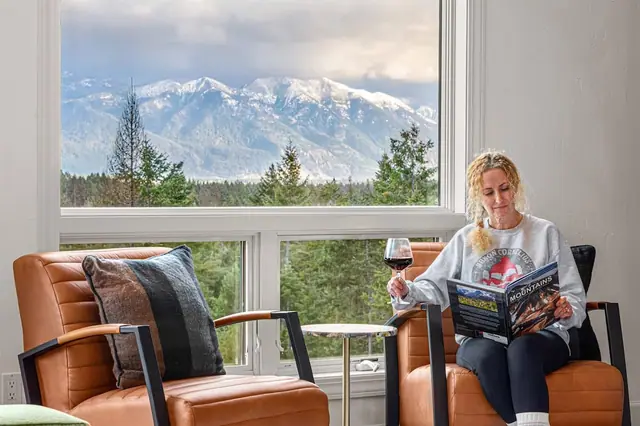 Curl up in a leather armchair with a glass of wine and a book while the snow-capped peaks fill your window.