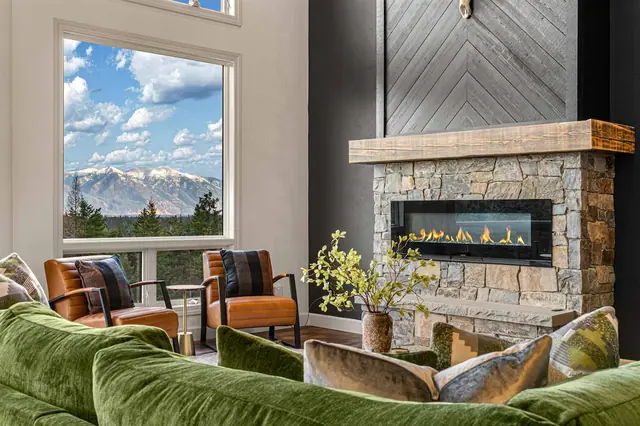 Put your feet up on the sectional facing the fireplace, coffee table close at hand for game night snacks.