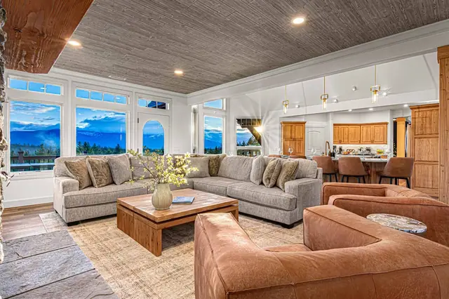 Wind down on the grey sectional at dusk as the mountain silhouette fades outside your window.