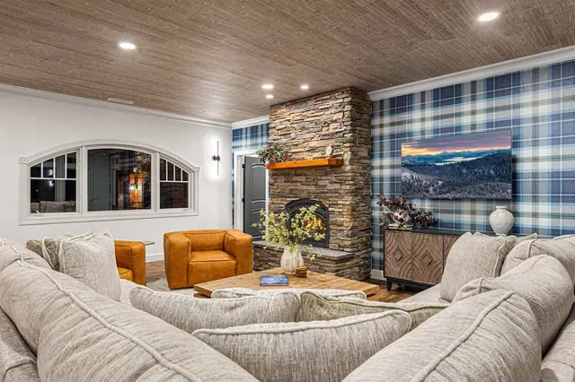 Pick up a book from the coffee table and post up by the lit fireplace in your second sitting room.