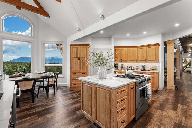 Fire up the gas range and cook with a mountain view through your arched kitchen window.