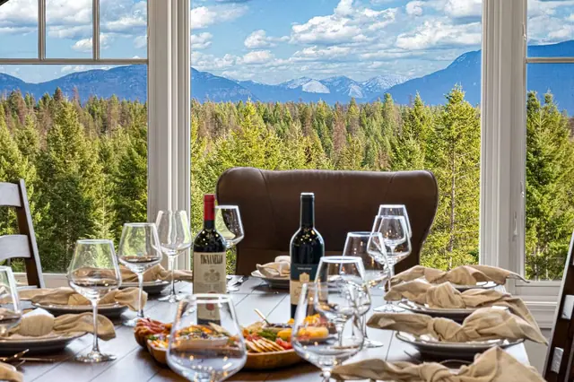 Lay out the charcuterie platter and settle into a leather-backed chair with the forest and peaks filling the window.