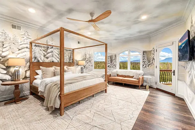 Step out the French doors onto your private balcony straight from the canopy bed suite.