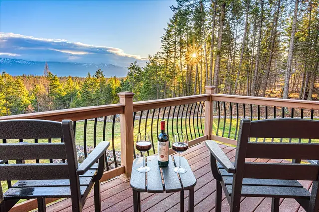 Pour a glass on your private balcony and watch the sunset settle over the forested mountains.
