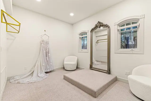 Hang your gown on the dressing room rod and get ready in front of the full-length mirror before the big moment.