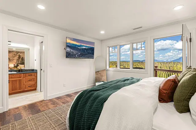 Flip on the wall-mounted TV for a sunset screensaver, or just look up at the real mountain sky through the windows.