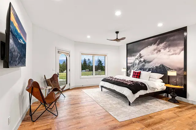 Sink into the butterfly chairs across from a wall-sized mountain photograph before heading out the glass door to the patio.