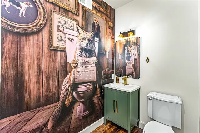 Get a laugh from the fox-in-a-bowler-hat mural the moment you step into the powder room.