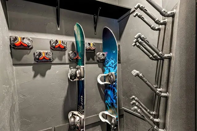 Hang your snowboards on the wall racks and let the boot holders keep your gear organized between runs.