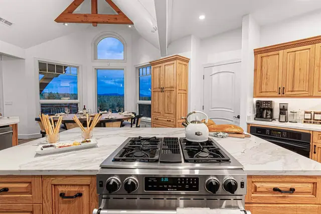 Slice the loaf right on the island cutting board while the cooktop's ready and dusk settles over the mountains.