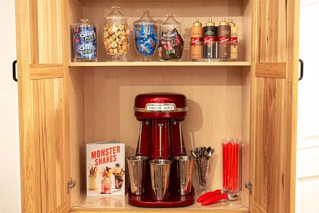 Raid the pantry's candy and cereal shelf, then blend up a shake with the vintage malt mixer and recipe book.