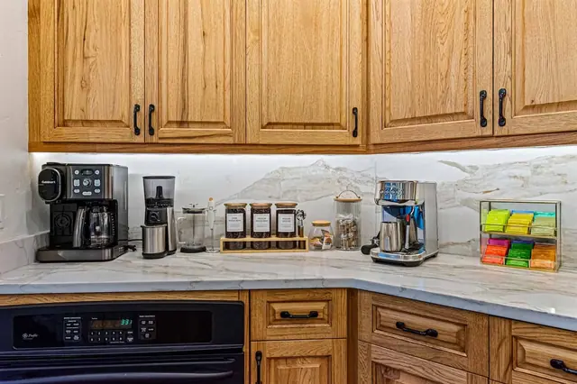 Grind your own beans or pop in a Keurig pod at the dedicated coffee station stocked with a full tea caddy.