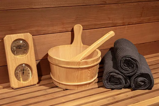 Ladle water over the stones and check the gauge to dial in your ideal sauna heat.
